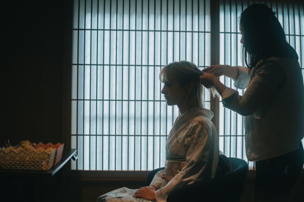 woman getting hair styling done